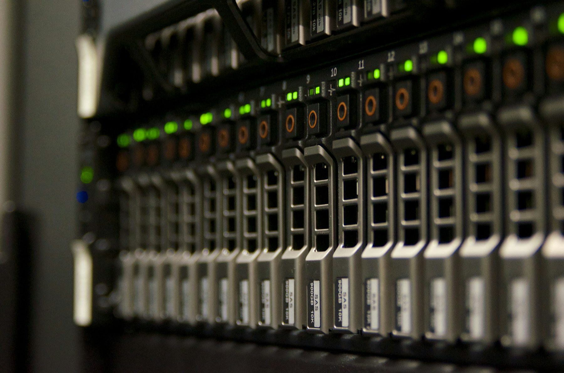 Server hardware with green status lights inside a network operations facility